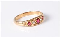 Lot 2627 - A ruby and diamond ring, the central oval ruby...