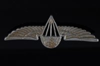 Lot 334 - A Ugandan Parachute Regiment wing badge, 9cm.