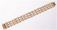 Lot 2202 - A 9ct gold cultured pearl bracelet, the three...