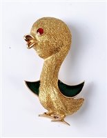 Lot 2200 - A novelty enamelled duck brooch, the stylised...