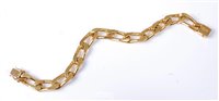Lot 2188 - An 18ct gold curblink bracelet, the flat...