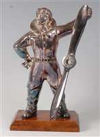 Lot 291 - A chromed metal table lighter in the form of...