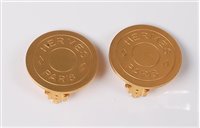Lot 2184 - A pair of Hermes earclips, the gilt metal...