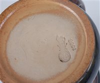 Lot 2092 - A Doulton stoneware commemorative tyg, of...