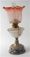 Lot 2421 - A late Victorian brass pedestal oil lamp,...