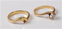 Lot 2190 - An '18k' gold diamond solitaire ring and...