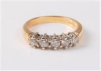Lot 2316 - An 18ct five stone diamond ring, the five...