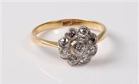 Lot 2293 - An 18ct diamond flowerhead cluster ring, the...