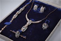 Lot 2243 - A white zircon and white hardstone suite, the...