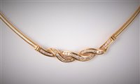 Lot 2195 - An 18ct gold diamond collarette, the smooth...
