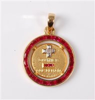 Lot 2263 - A ruby and diamond pendant, the round pendant...