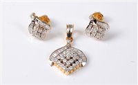 Lot 2290 - A diamond pendant and matching earrings, the...