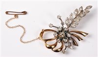 Lot 2325 - A diamond floral spray brooch, the central...