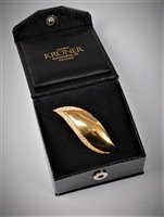 Lot 2321 - A German 18ct and diamond leaf brooch, the...