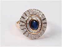 Lot 2246 - A sapphire and diamond cluster ring, the oval...