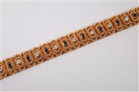 Lot 2201 - An 18ct gold sapphire and diamond bracelet,...