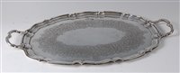 Lot 2145 - A modern silver twin handle salver, of oval...