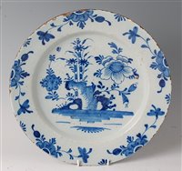 Lot 2077 - An 18th century English Delft charger, blue...