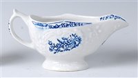 Lot 2084 - A Lowestoft porcelain relief moulded sauceboat,...