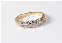 Lot 2563 - An 18ct five stone diamond ring, the five...