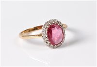 Lot 1188 - An 18ct pink sapphire and diamond ring, the...