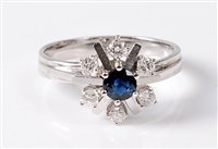 Lot 2514 - A 14ct sapphire and diamond snowflake cluster...