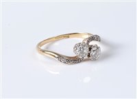 Lot 2540 - An 18ct two diamond 'toi et moi' crossover...