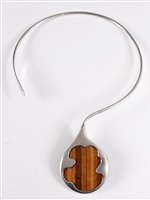 Lot 159 - A silver and tigers eye torque necklace, the...