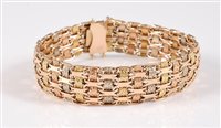 Lot 1211 - A tri-coloured gold bracelet, the alternating...
