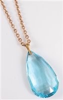 Lot 2530 - An aquamarine pendant and 9ct chain, the large...