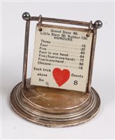 Lot 108 - An early Art Deco silver bridge card marker,...