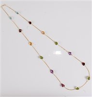 Lot 1183 - A multi gemset necklace, the mixed cut...