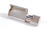 Lot 1151 - A French silver, gold and sapphire lipstick...
