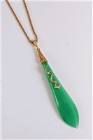 Lot 1182 - A jade and diamond pendant, the elongated...