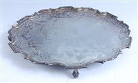 Lot 1121 - A George V silver salver, having a piecrust...