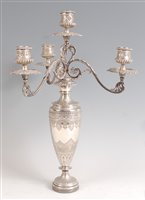 Lot 1122 - A Victorian silver four light candelabrum, the...