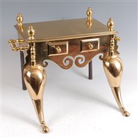 Lot 1246 - A Regency heavy brass footman, having twin end...