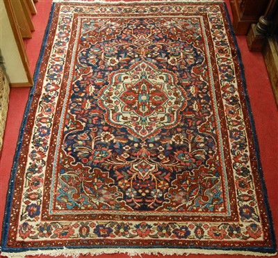 Lot 1137 - A Persian woollen Tafresh rug, having a floral...