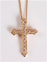 Lot 2543 - An 18ct diamond cross pendant and chain, the...