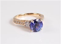 Lot 2640 - A 14k tanzanite and diamond ring, the round...