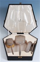 Lot 133 - An Art Deco engine turned silver four-piece...