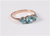 Lot 2544 - A three stone zircon ring, the three graduated...