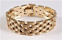 Lot 1196 - A 9ct bracelet, the 18mm wide brick link...