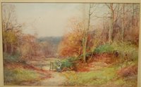 Lot 1067 - Sylvester Stannard - figure at a woodland gate,...