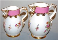 Lot 196 - A pair of graduated porcelain mask jugs, each...