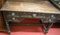 Lot 1271 - An early 20th century heavily carved oak...