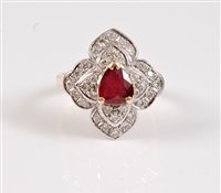 Lot 1186 - An 18ct ruby and diamond ring, the central...