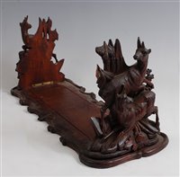 Lot 1287 - A circa 1900 Black Forest bookslide, the...