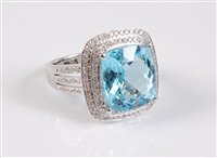 Lot 1162 - A 14k topaz and diamond ring, them square...