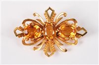 Lot 2595 - A 9ct citrine brooch, the three oval citrines,...
